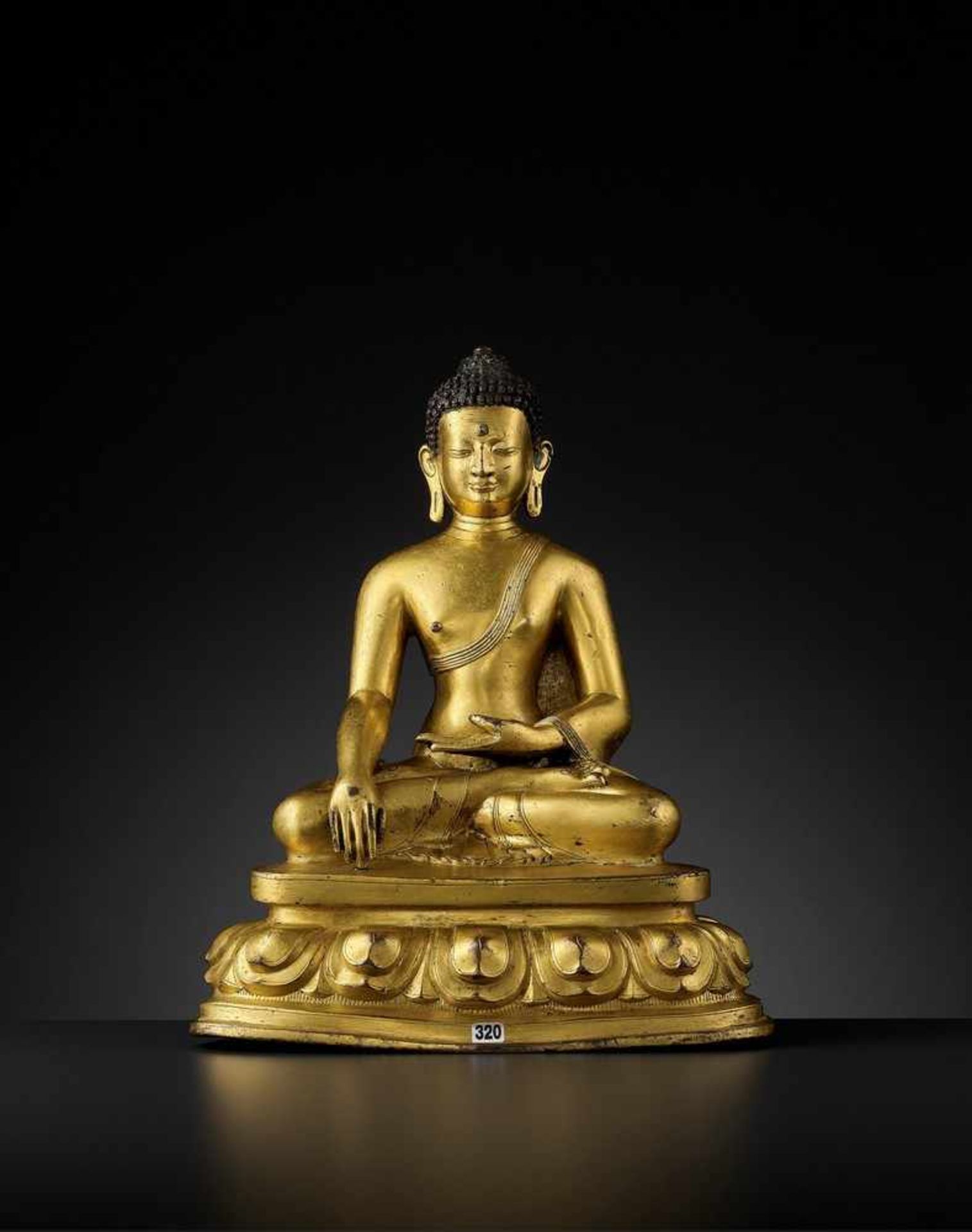 A GILT COPPER ALLOY FIGURE OF BUDDHA SHAKYAMUNI, PROBABLY DENSATIL