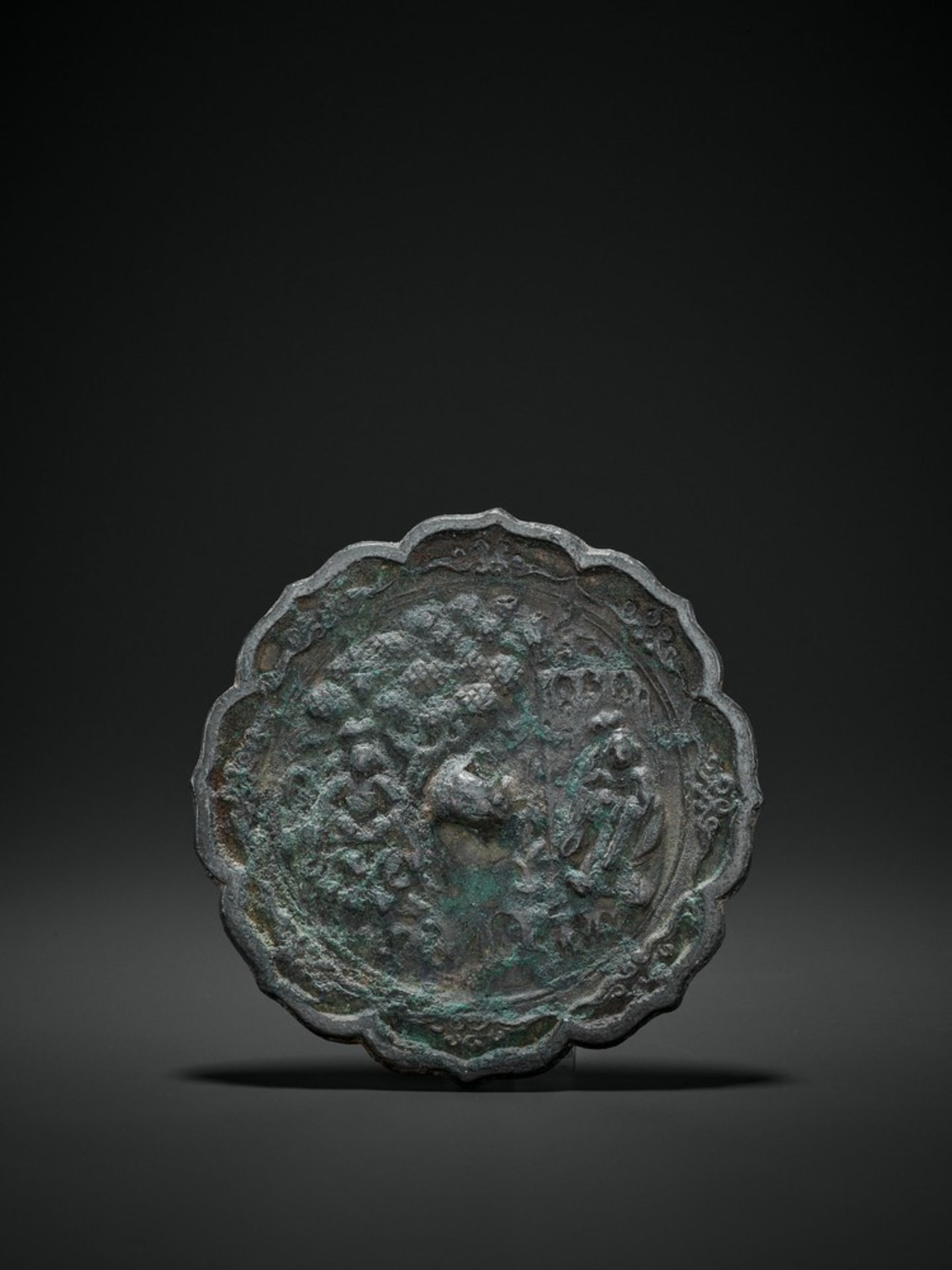 A BRONZE LOBED CIRCULAR MIRROR, TANG DYNASTY