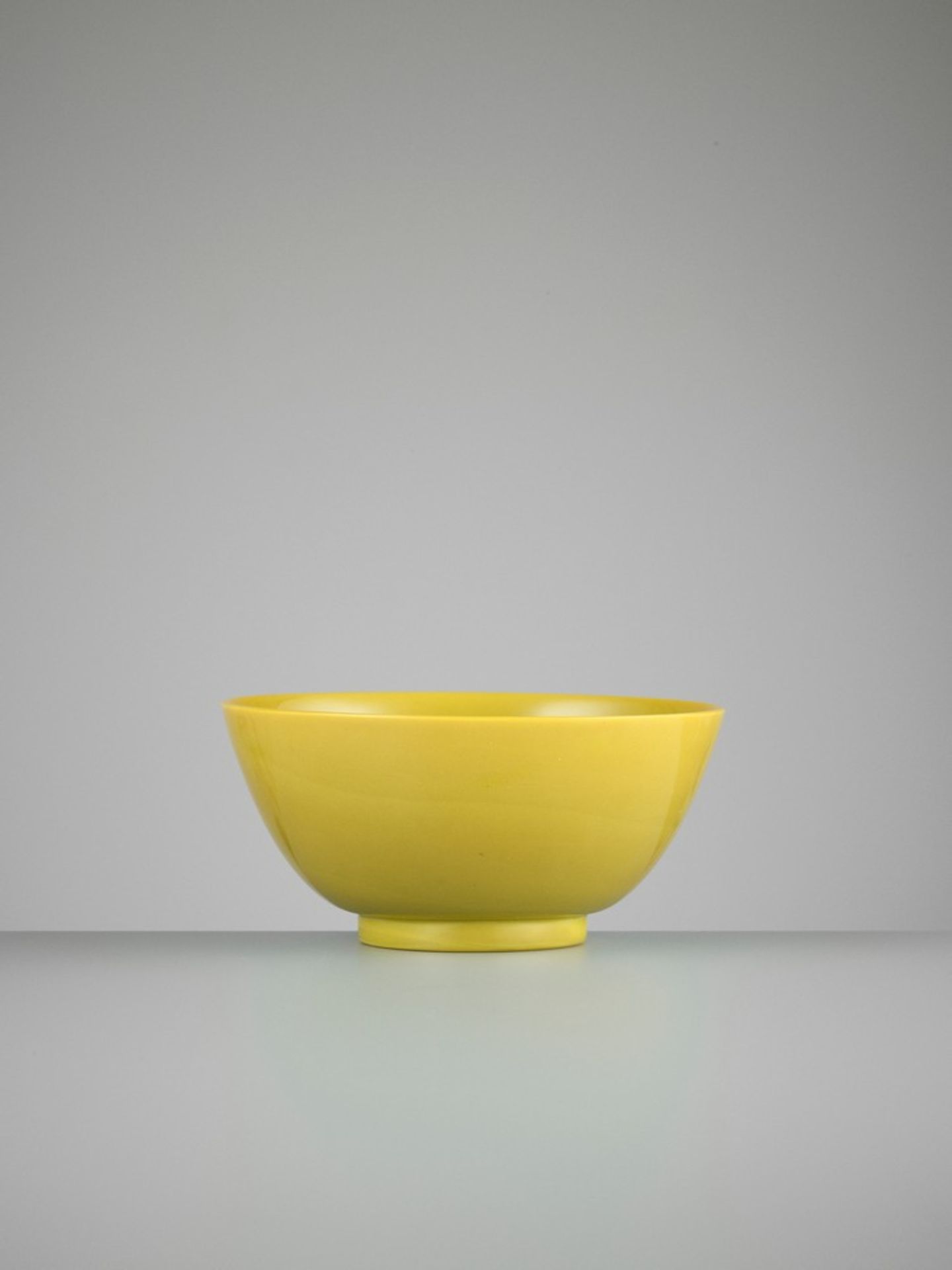 A MUSTARD-YELLOW GLASS BOWL, PROBABLY IMPERIAL, QING DYNASTY