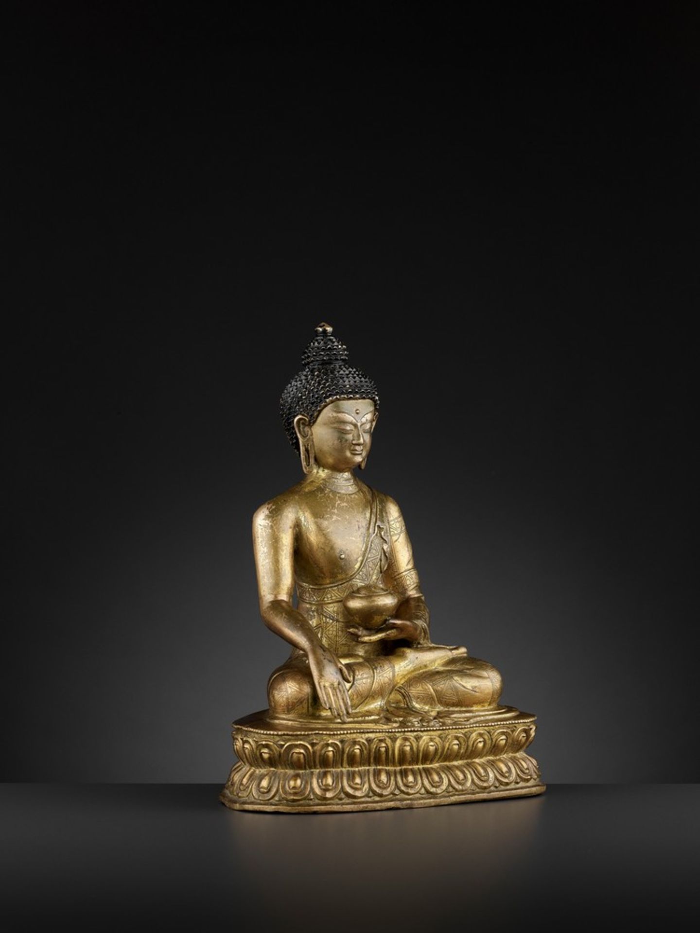 A GILT-BRONZE FIGURE OF BUDDHA SHAKYAMUNI, BEIJING OR INNER MONGOLIA, 17TH CENTURY - Image 8 of 11