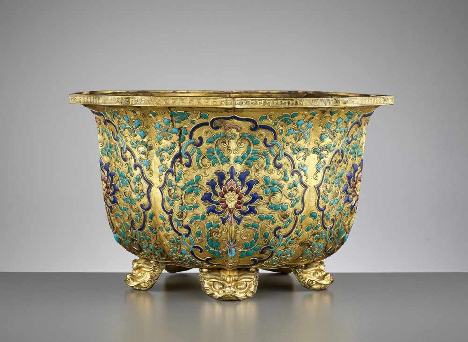 A RARE GILT-COPPER CHAMPLEVÉ ENAMEL JARDINIERE, QIANLONG <