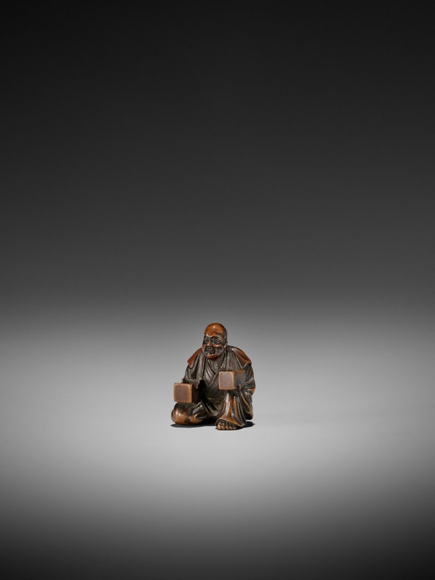 GYOKKO: A FINE WOOD NETSUKE OF A MASK SELLER By Gyokko, signed Gyokko 玉光Japan, Edo, mid-19th - Bild 9 aus 11