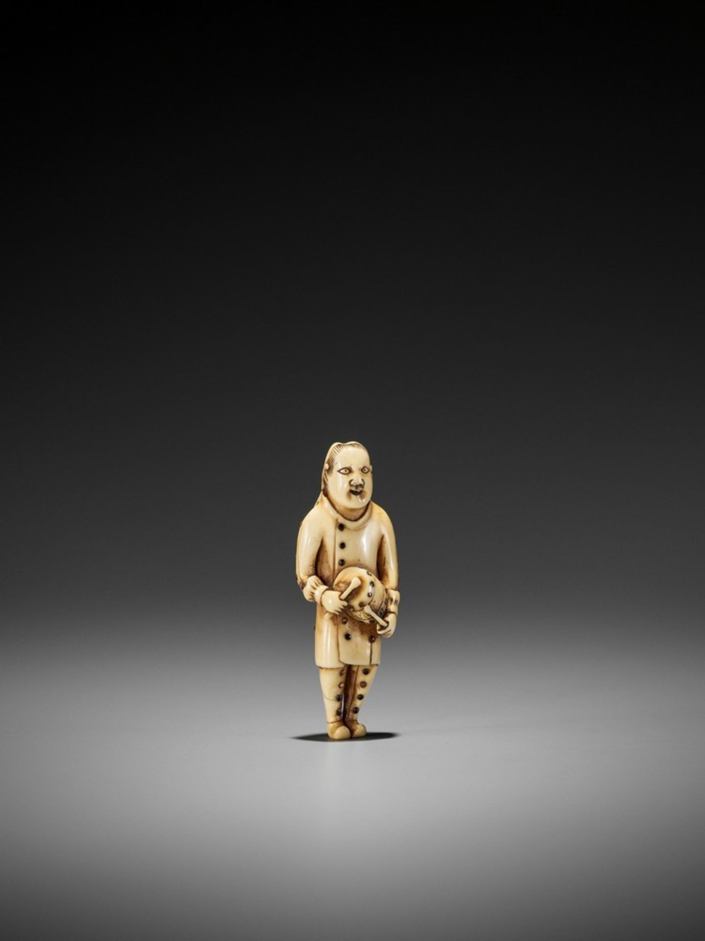 A RARE IVORY NETSUKE OF A DUTCH CHILD PLAYING THE DRUM UnsignedJapan, 18th century, Edo period (