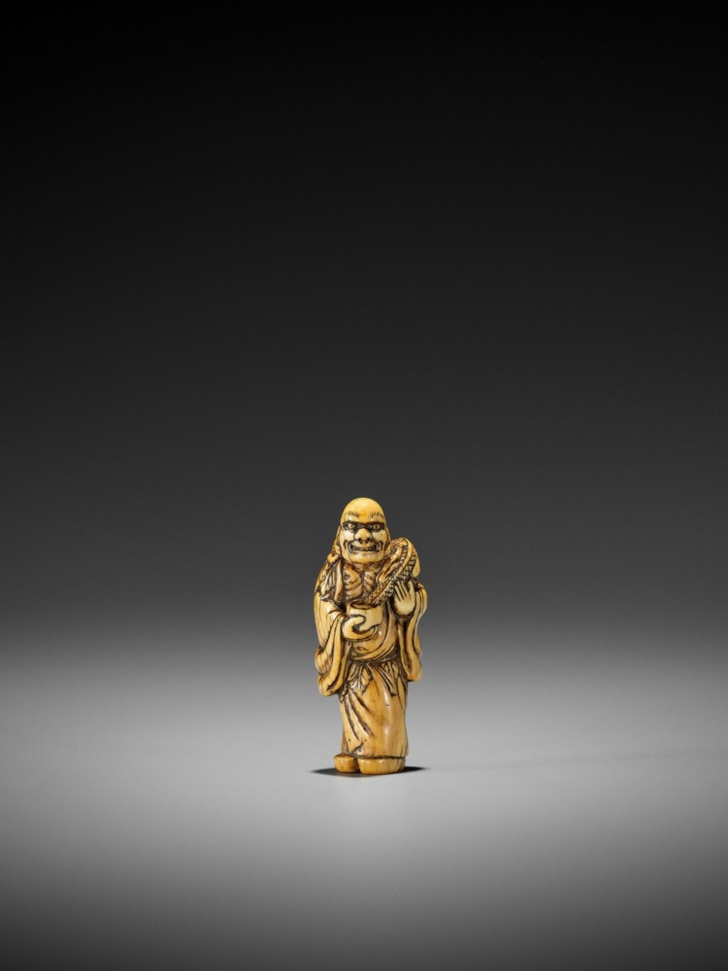 AN EARLY IVORY NETSUKE OF CHINNAN SENNIN UnsignedJapan, 18th century, Edo period (1615-1868)An early