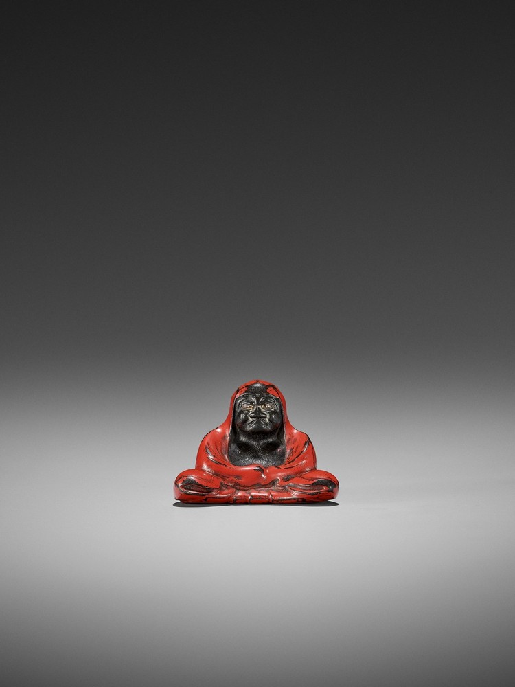 A RARE LACQUERED DARK WOOD NETSUKE OF DARUMA UnsignedJapan, second half of 19th centuryBodhidharma