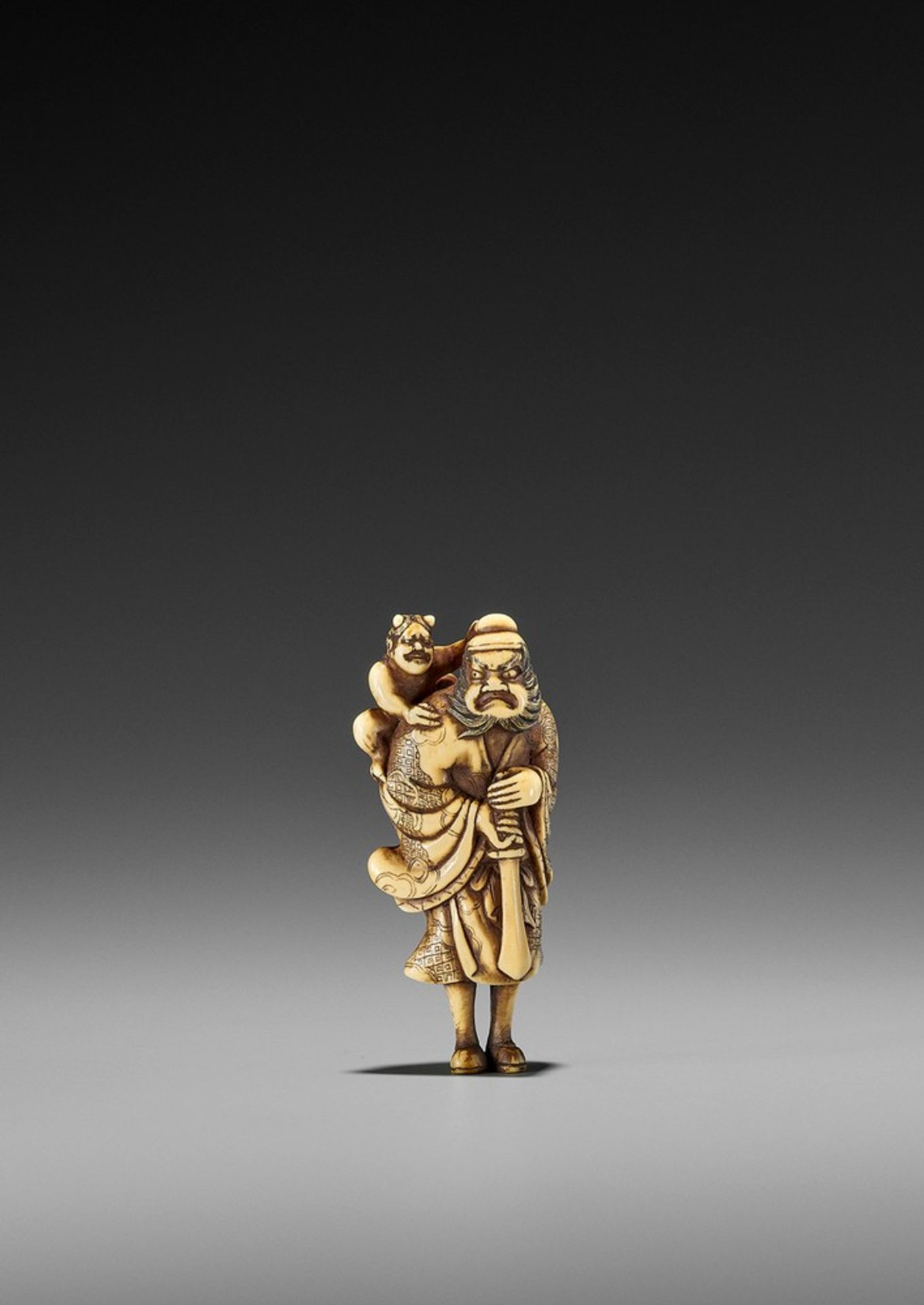 A FINE IVORY NETSUKE OF SHOKI AND ONI UnsignedJapan, probably Kyoto, late 18th to early 19th