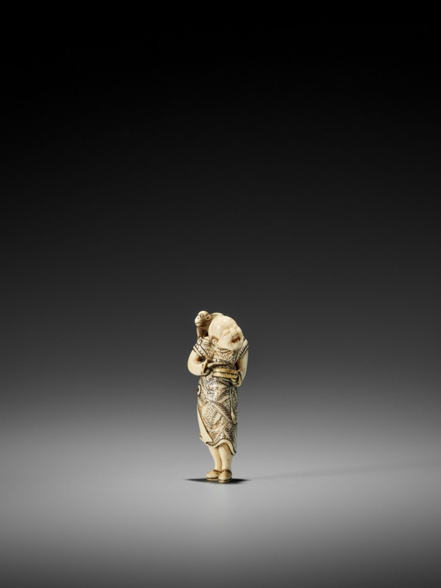 GISHO: AN IVORY NETSUKE OF A SARUMAWASHI By Gisho (Gijo), signed Gisho 義證Japan, late 18th to early