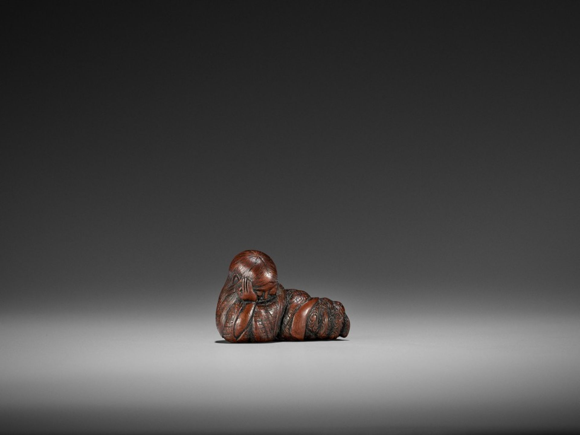 TOSHIMASA: AN EXCELLENT WOOD NETSUKE OF A SLEEPING SHOJO By Toshimasa, signed Toshimasa 利正Japan,