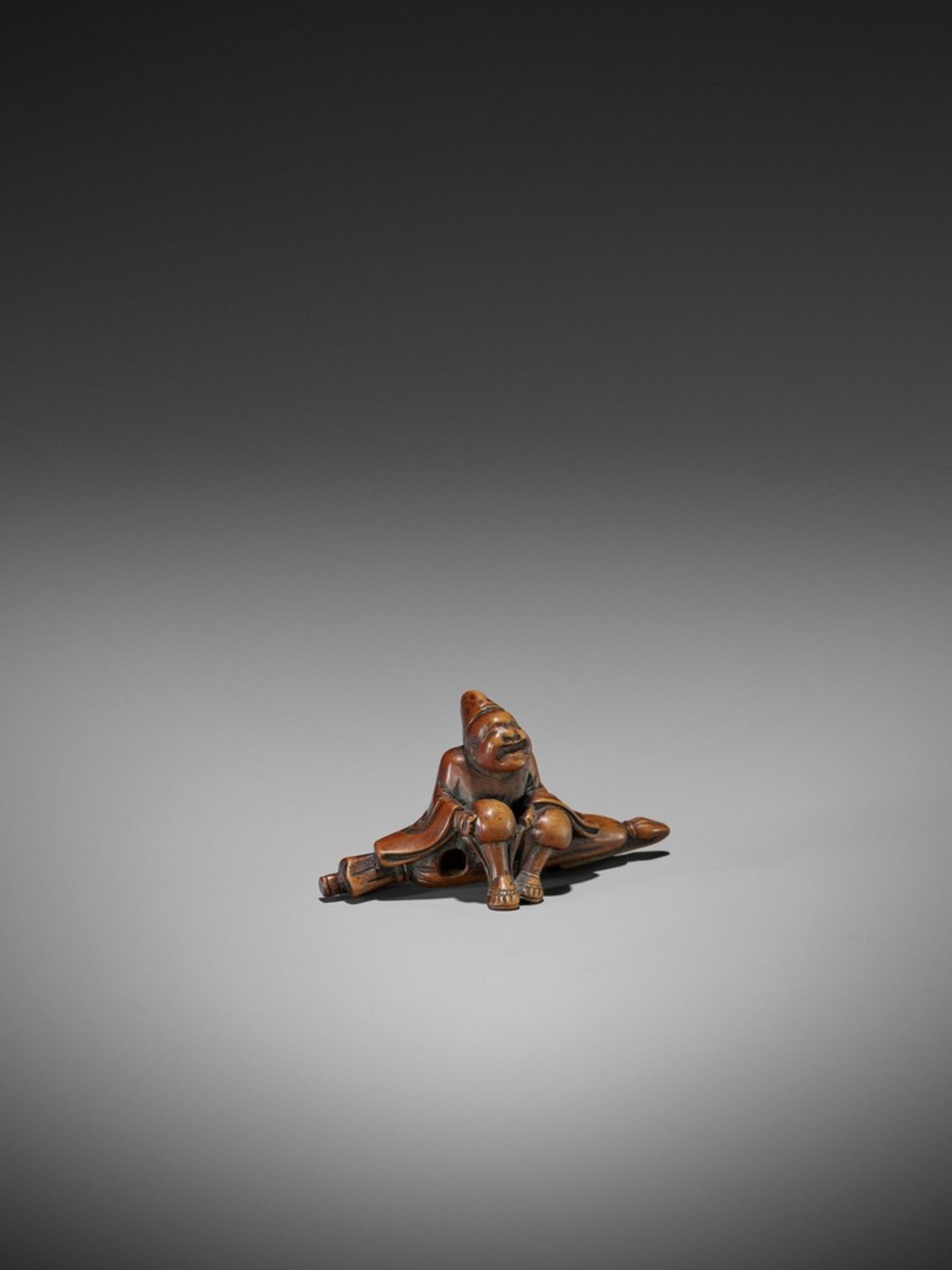 A WOOD NETSUKE OF A TEMPLE SERVANT (EJI) UnsignedJapan, probably Edo, early 19th century, Edo period