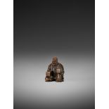 GYOKKO: A FINE WOOD NETSUKE OF A MASK SELLER By Gyokko, signed Gyokko 玉光Japan, Edo, mid-19th