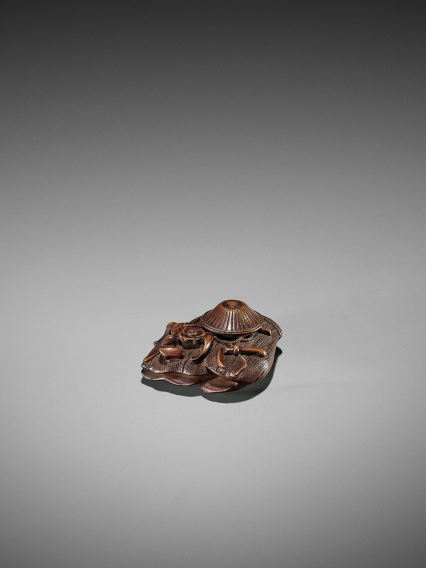 A WOOD NETSUKE REFERENCING OTA DOKAN UnsignedJapan, late 18th to early 19th century, Edo period (