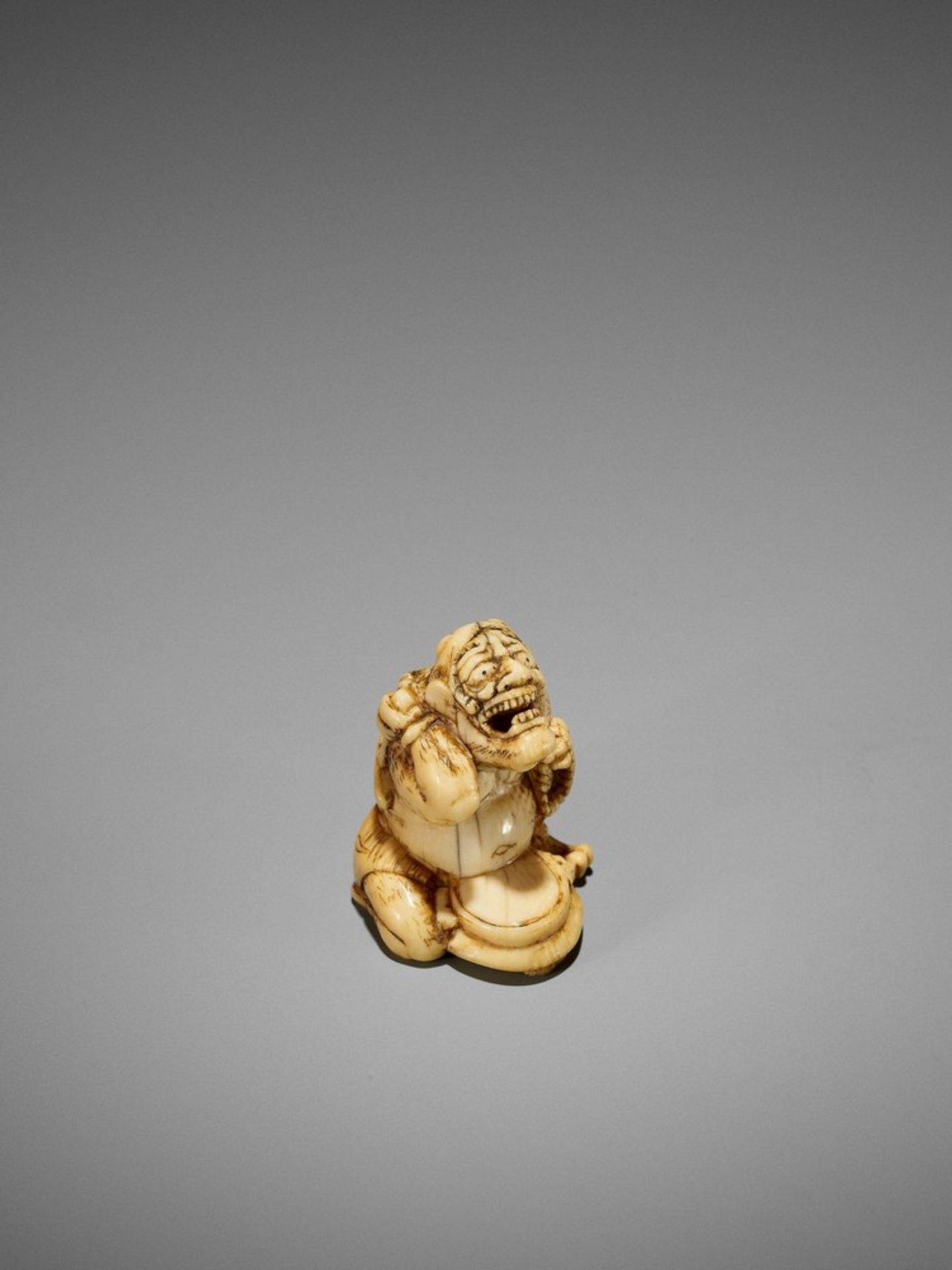 AN EARLY IVORY NETSUKE OF A REPENTING ONI UnsignedJapan, 18th century, Edo period (1615-1868)The