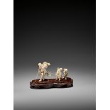 A CHARMING WOOD AND IVORY OKIMONO OF THREE BLINDMEN CROSSING A STREAM Japan, Meiji period (1868-