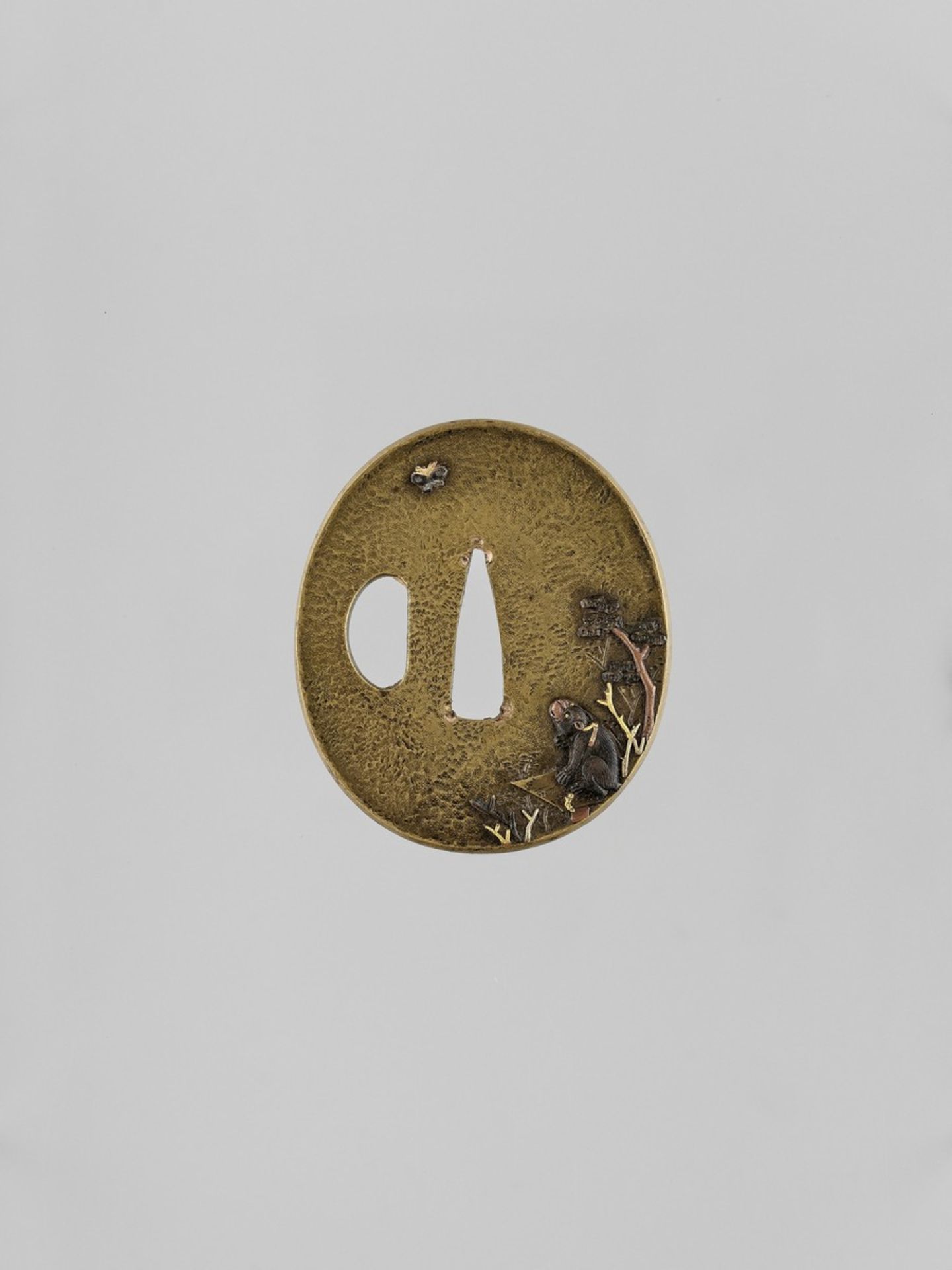 AN INLAID SENTOKU TSUBA WITH A MONKEY AND BUTTERFLY Japan, 19th century, Edo period (1615-1868)Of