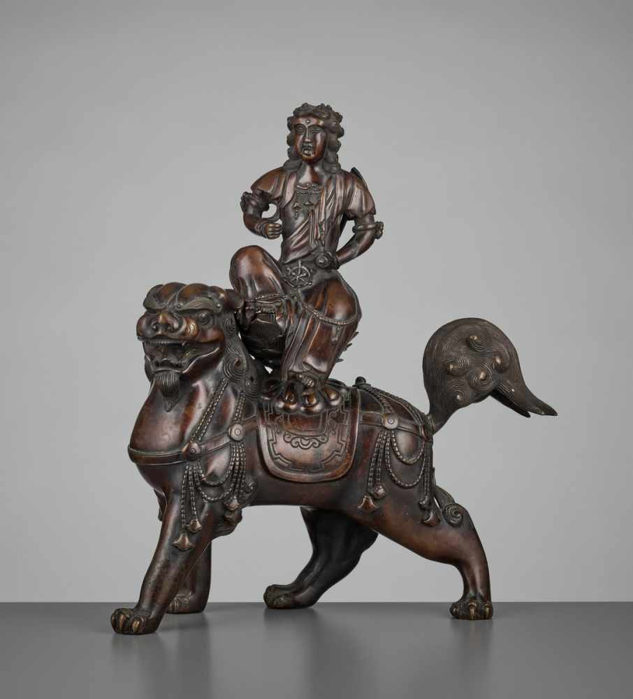 A BRONZE GROUP OF KISHI MONJU BOSATSU RIDING A SHISHI Japan, 18th century, Edo period (1615-1868)