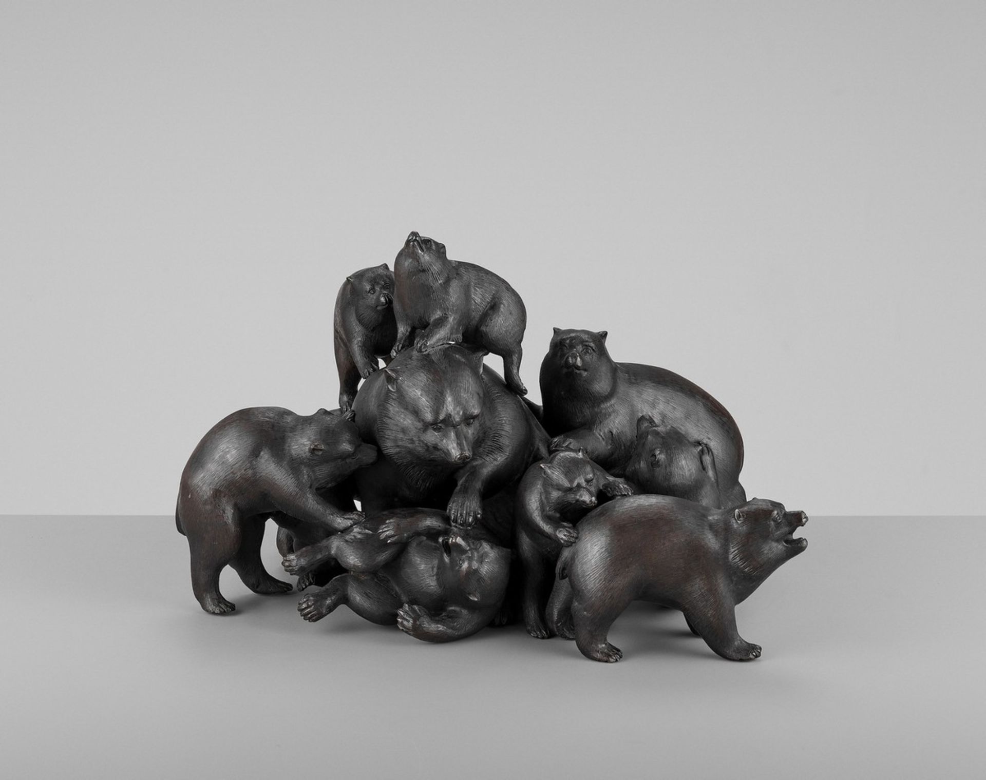 UNKOKU: AN EXTREMELY RARE PATINATED OKIMONO GROUP OF HIMALAYAN BROWN BEARS IN A PILE By Unkoku,