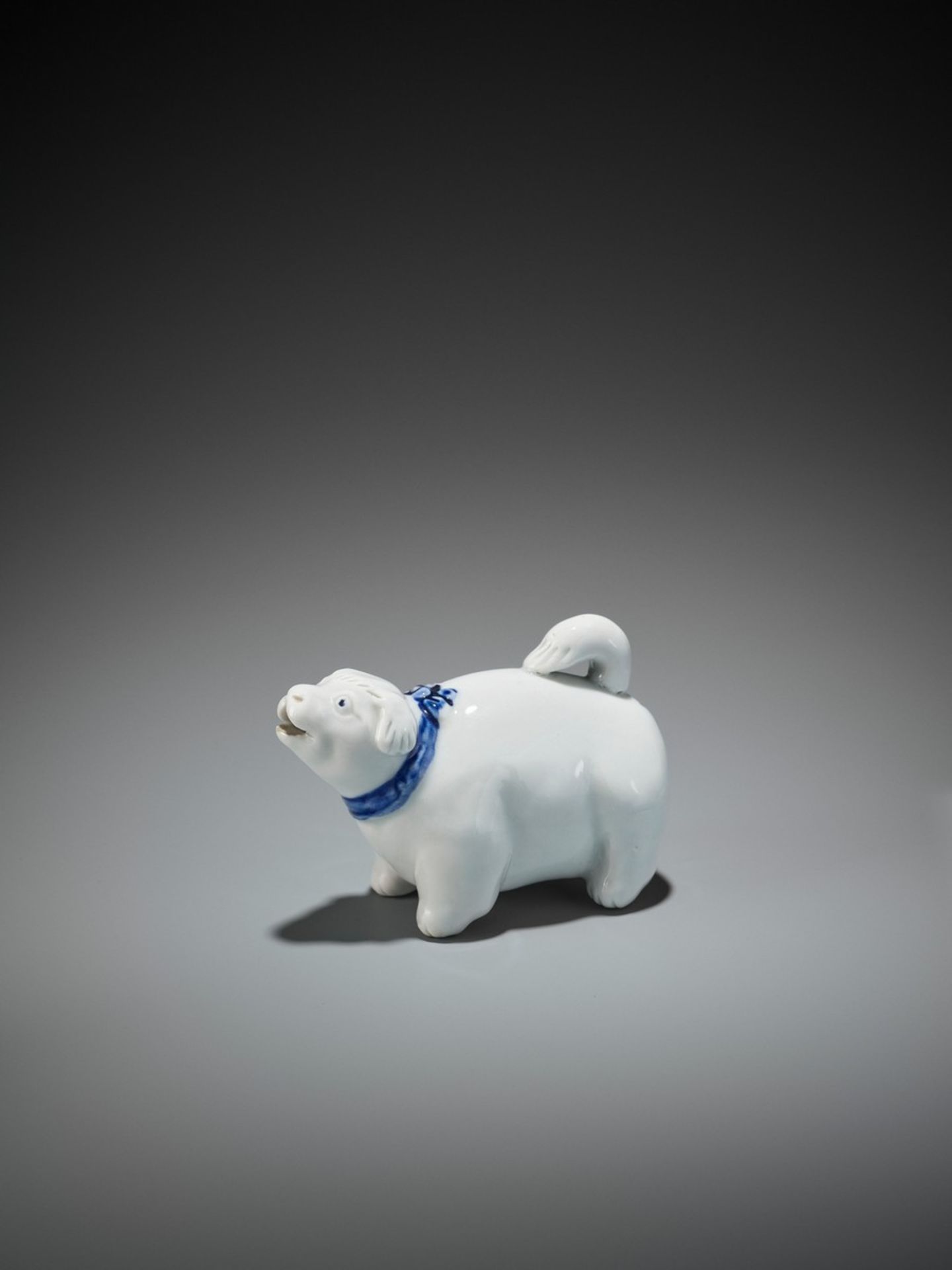 A RARE AND CHARMING HIRADO PORCELAIN DOG-SHAPED SUITEKI (WATER DROPPER) Japan, 19th century, Edo