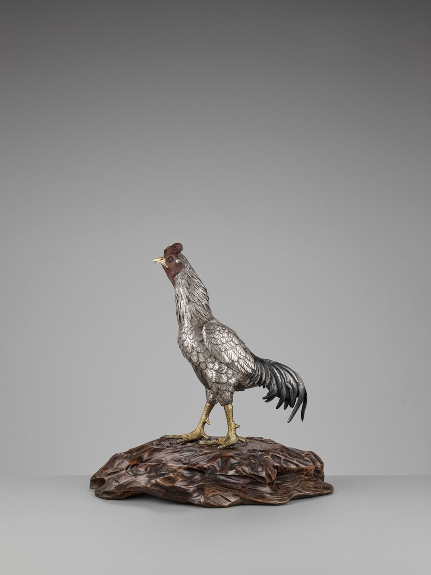 SEIYA: AN UNUSUAL AND RARE PARCEL-GILT SILVERED BRONZE OKIMONO OF A COCKEREL By Genryusai Seiya, - Image 3 of 14