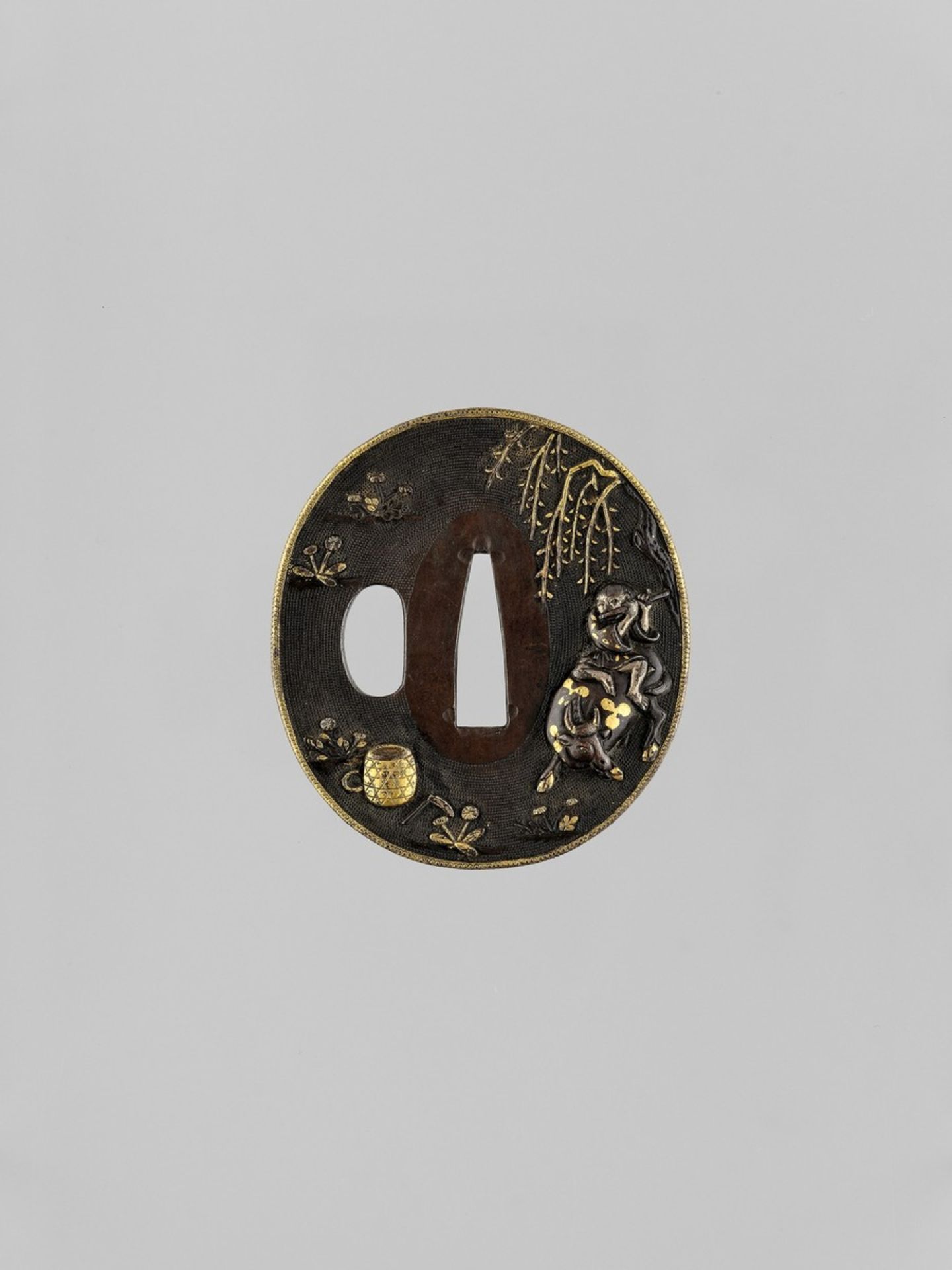 A GOLD AND SILVER-INLAID SHAKUDO TSUBA WITH OX AND BOKUDO Japan, 19th century, Edo period (1615-