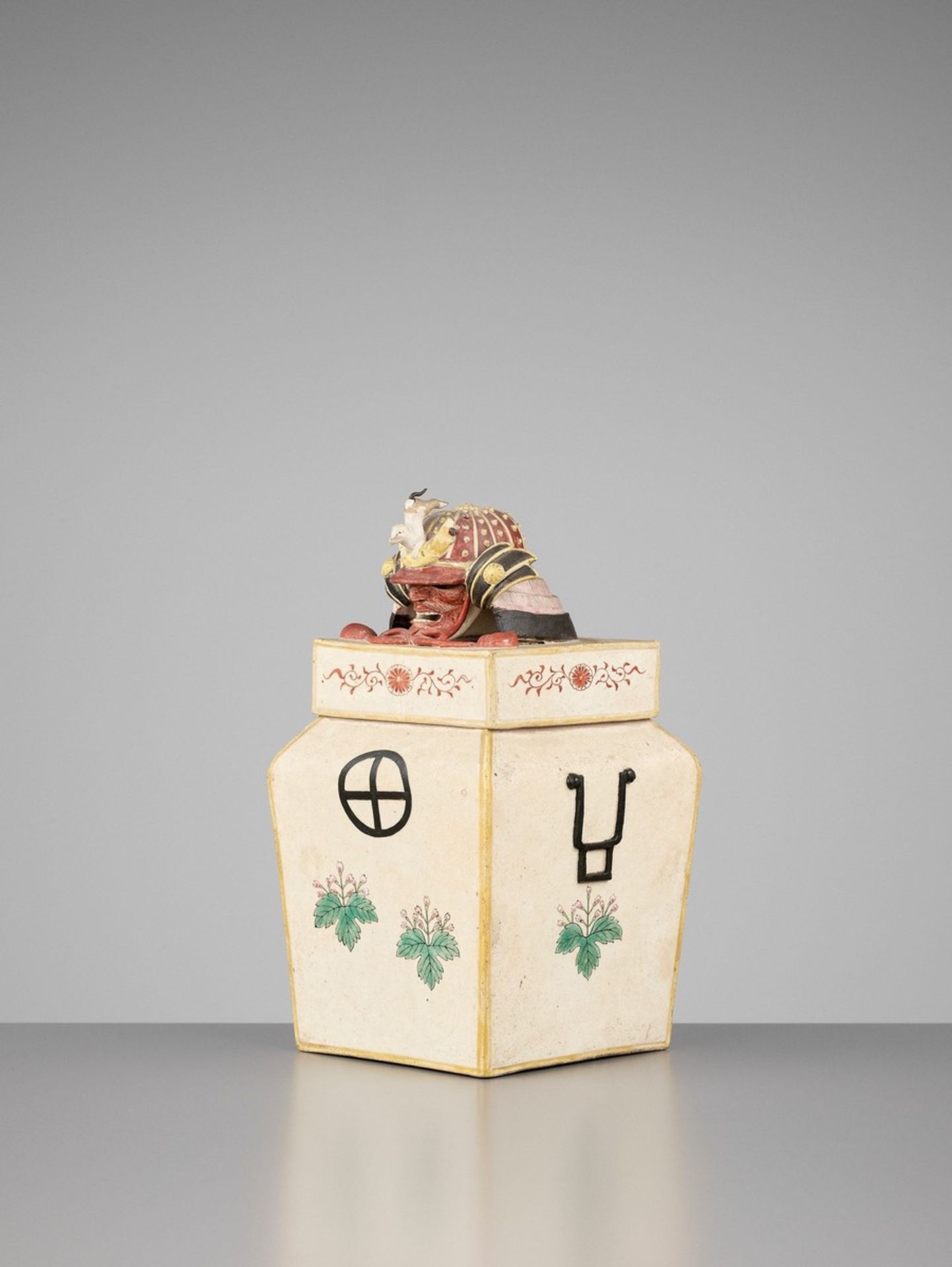 A RARE AND UNUSUAL POLYCHROME ENAMELED CERAMIC MINIATURE ARMOR STORAGE BOX Japan, 19th centuryMolded