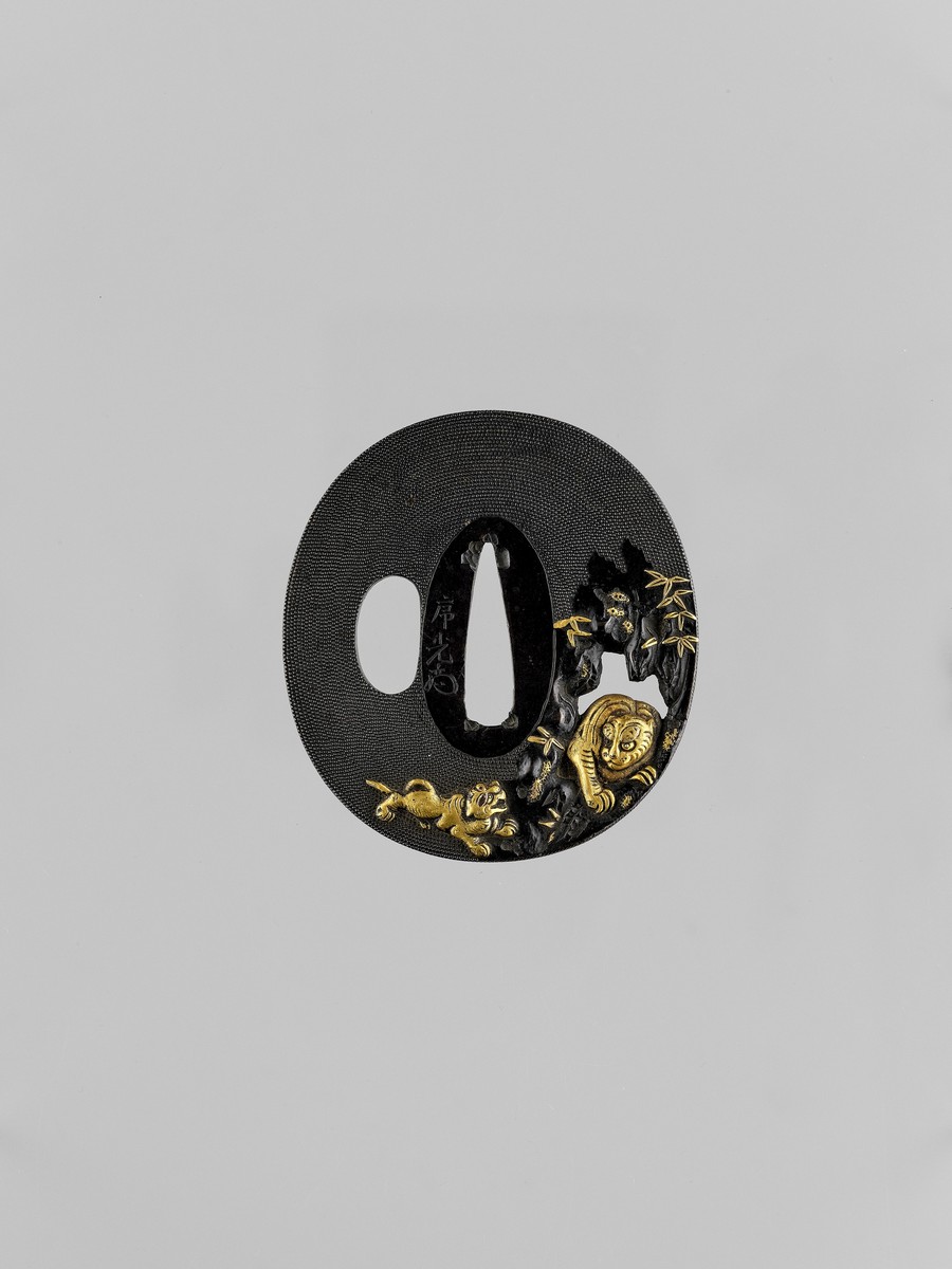 A FINE GOTO-SCHOOL GOLD-INLAID SHAKUDO TSUBA WITH TIGERS AND BAMBOO Signed with a kakihan and