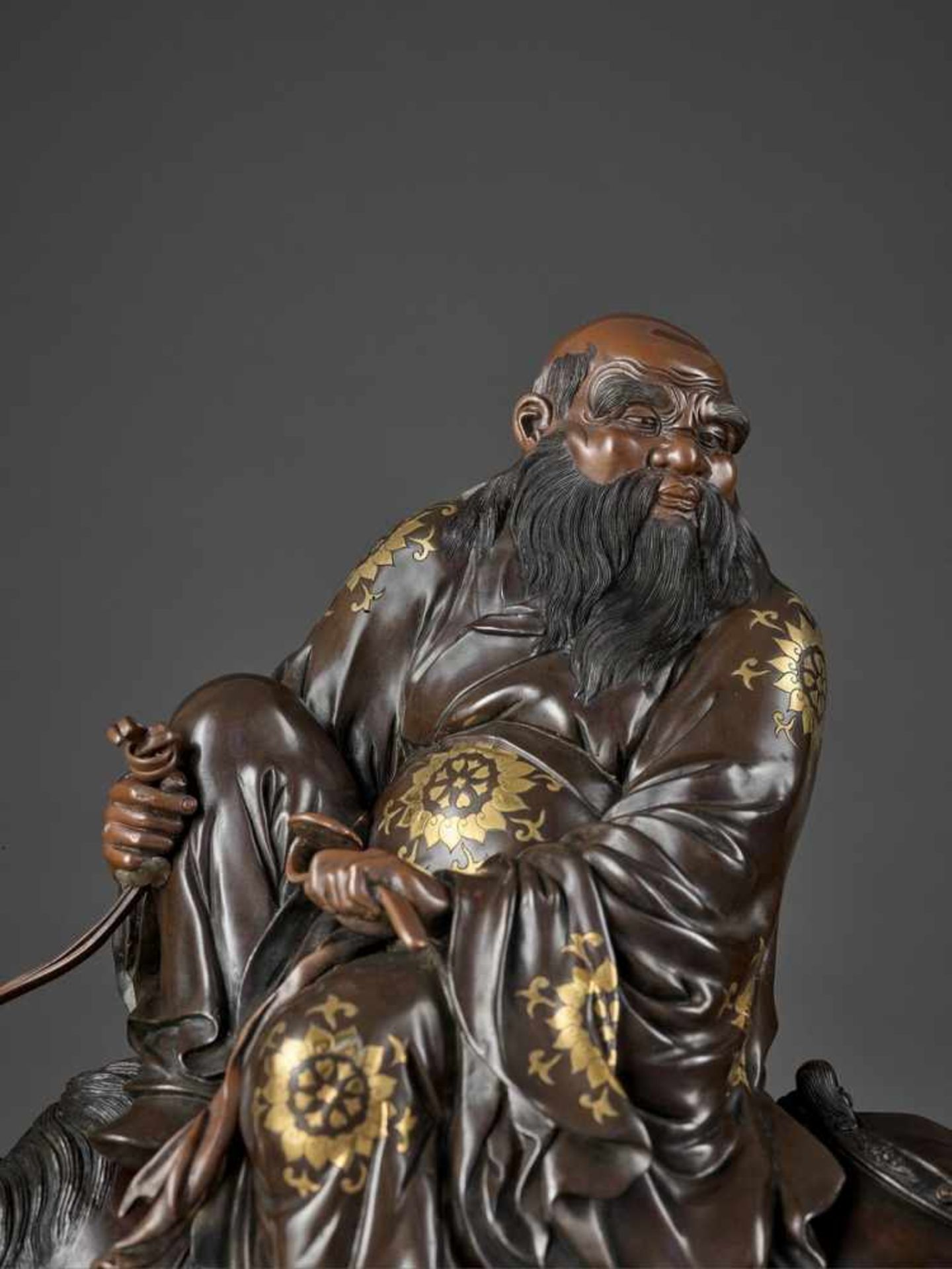 A SPECTACULAR AND MASSIVE PARCEL GILT BRONZE FIGURE OF TOBA SEATED ON A MULE Attributed to the Miyao - Image 2 of 12