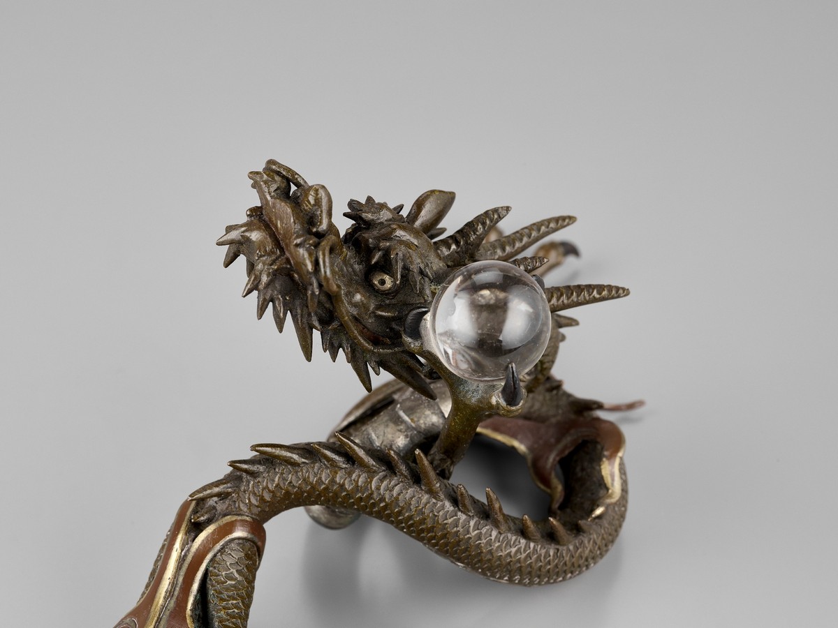 A BRONZE OKIMONO OF A DRAGON WITH ROCK CRYSTAL BALL Japan, Meiji period (1868-1912)Finely cast as - Image 3 of 10