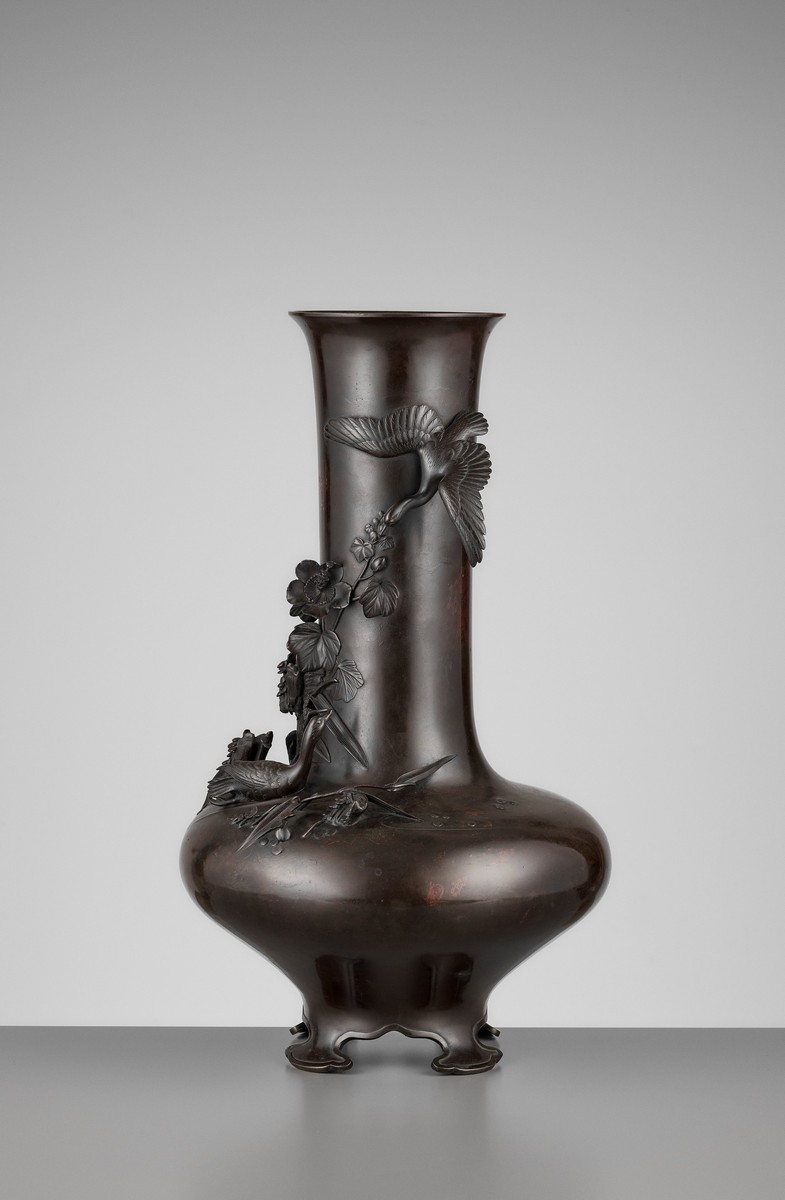 A LARGE BRONZE VASE WITH GEESE AND WATER LILIES Japan, Meiji period (1868-1912)The vase with a