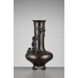 A LARGE BRONZE VASE WITH GEESE AND WATER LILIES Japan, Meiji period (1868-1912)The vase with a