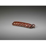 A WOOD SASHI NETSUKE OF AN EDAMAME BEAN POD Japan, 19th century, Edo period (1615-1868)