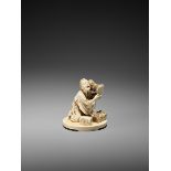 AN IVORY OKIMONO OF A COURT DRUMMER Japan, Meiji period (1868-1912)The man half-kneeling on the oval