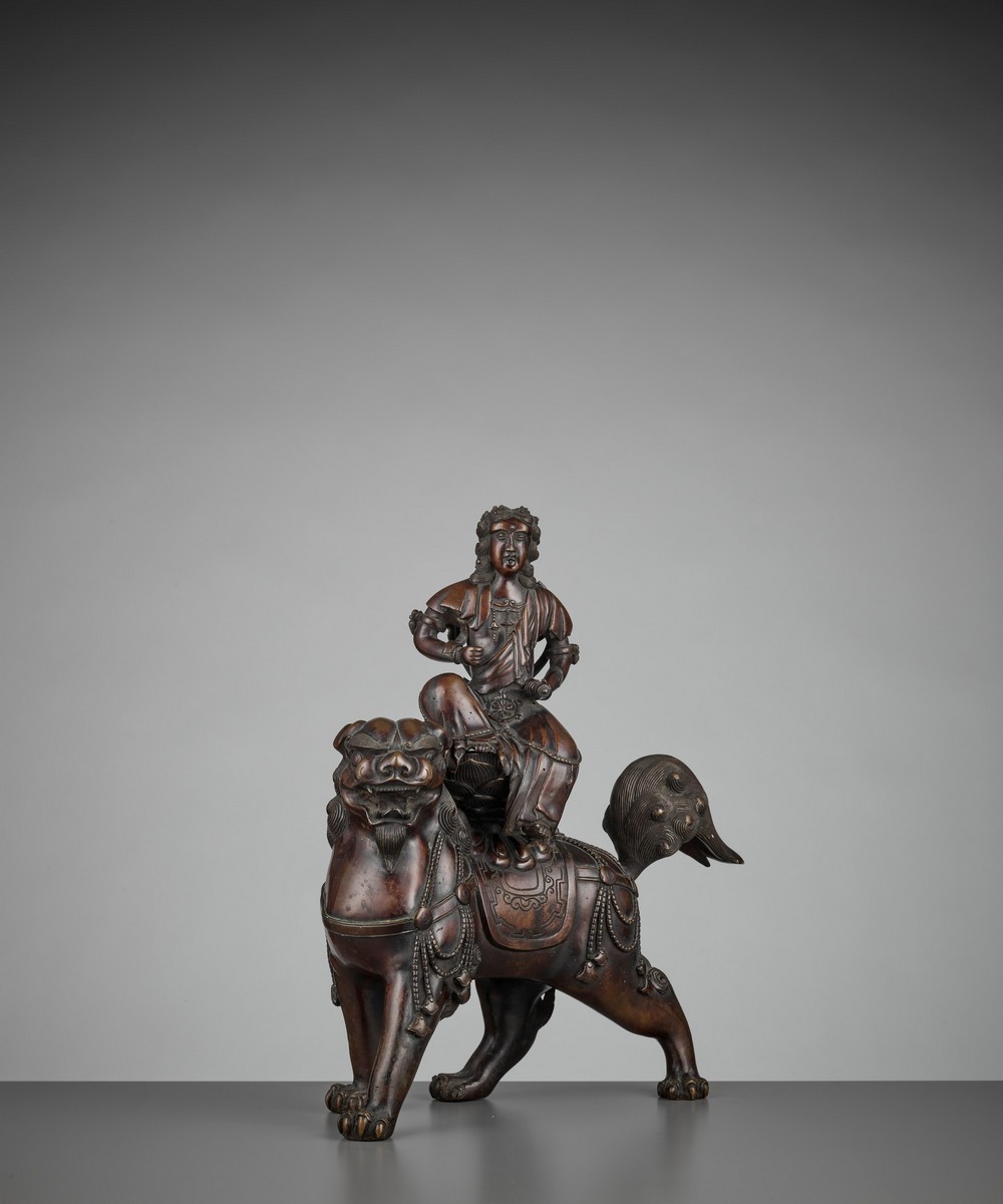 A BRONZE GROUP OF KISHI MONJU BOSATSU RIDING A SHISHI Japan, 18th century, Edo period (1615-1868) - Image 10 of 13