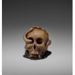 SUKEYUKI: A MASTERFUL WOOD OKIMONO OF A SNAKE AND SKULL By Sukeyuki, signed Sukeyuki zoJapan, Hida