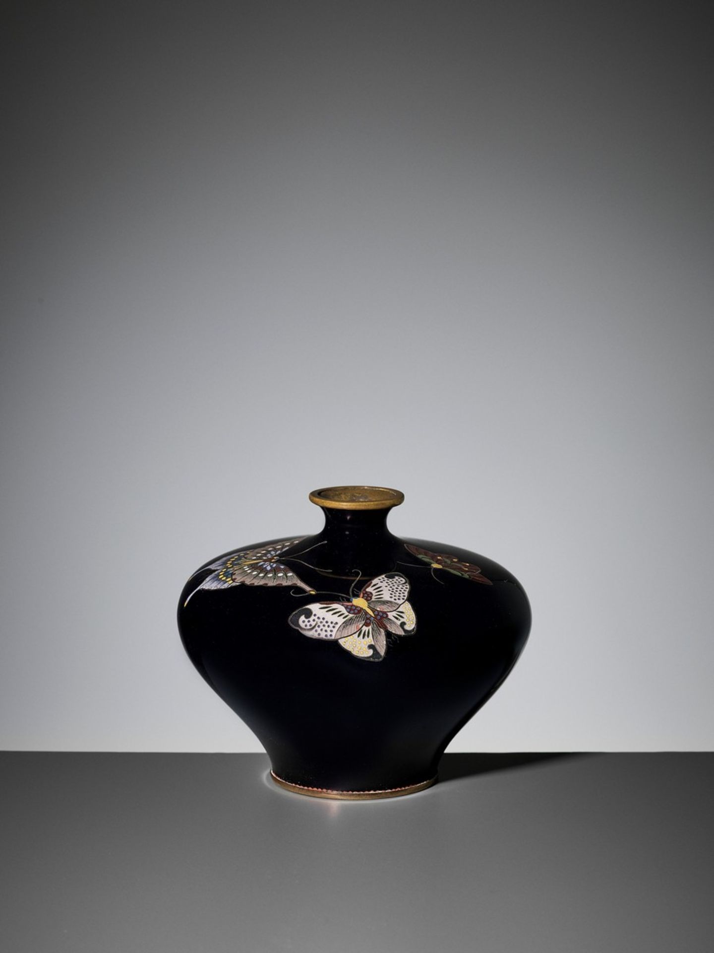 A MIDNIGHT BLUE CLOISONNÉ VASE WITH BUTTERFLIES Japan, Meiji period (1868-1912)The vase with an
