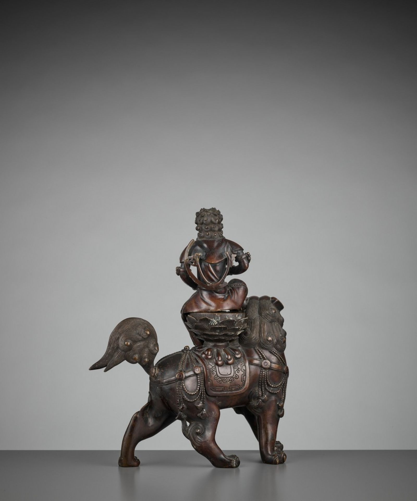 A BRONZE GROUP OF KISHI MONJU BOSATSU RIDING A SHISHI Japan, 18th century, Edo period (1615-1868) - Image 6 of 13