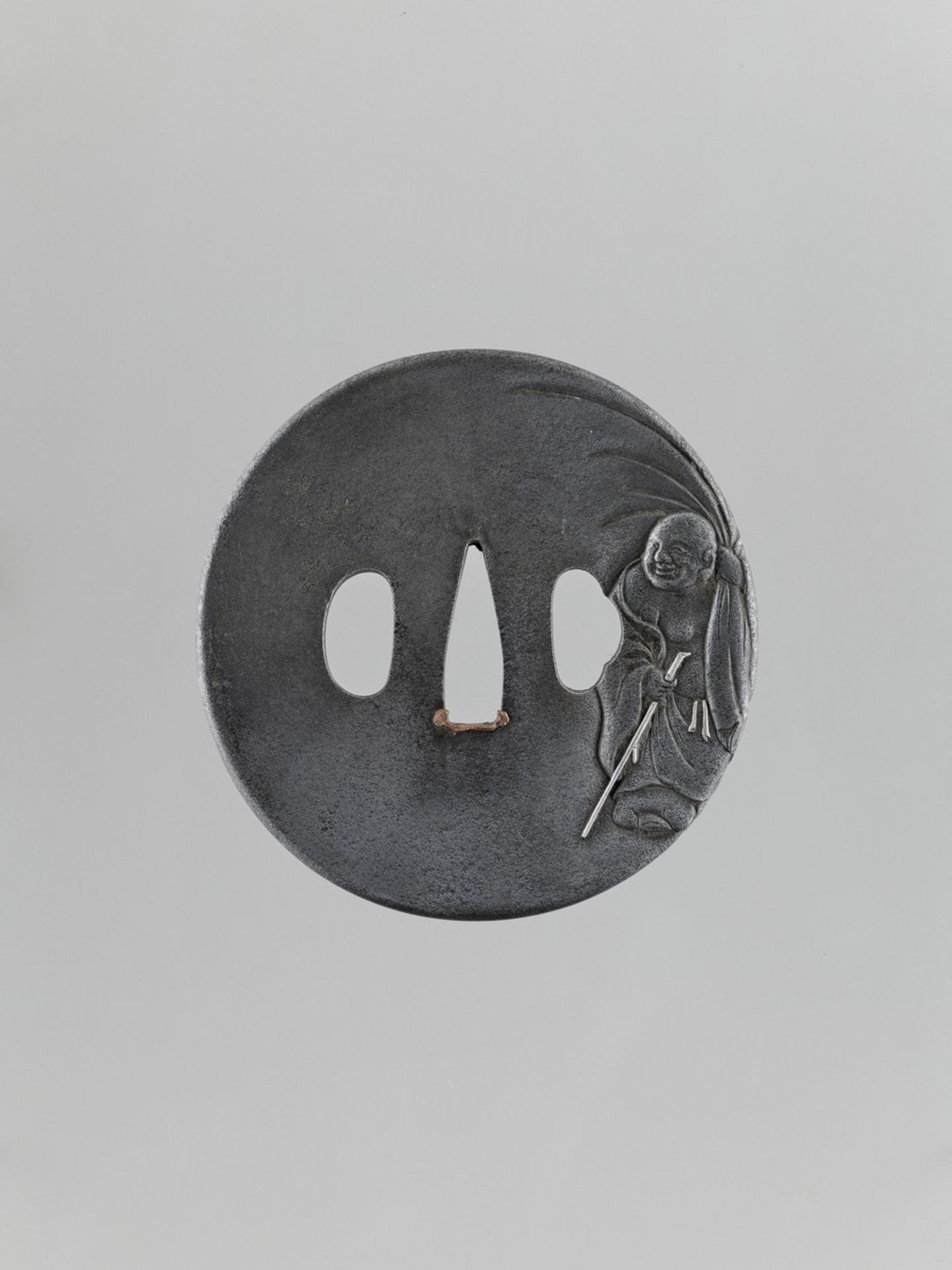 A SILVERED IRON TSUBA OF HOTEI Japan, 18th to 19th century, Edo period (1615-1868)The tsuba of