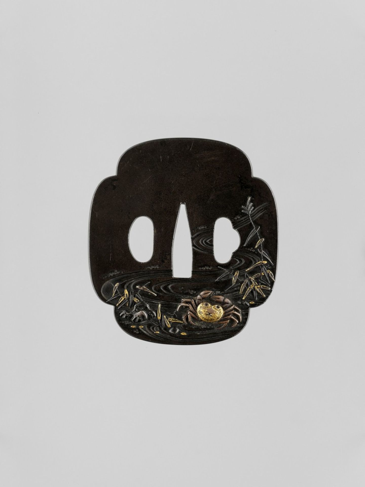 TOSHITSUGU: A GILT-INLAID SHIBUICHI TSUBA WITH A CRAB Signed Toshitsugu with kakihanJapan, 19th