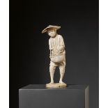 HOSAI: A LARGE TOKYO SCHOOL IVORY OKIMONO OF A FARMER