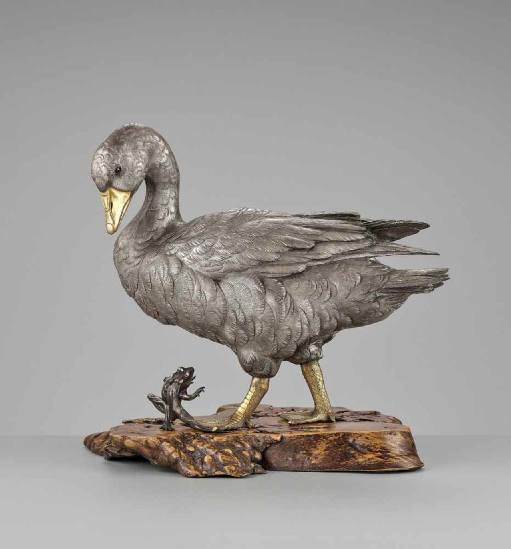 OSHIMOTO SEIJI: AN EXTREMELY FINE AND LARGE PARCEL-GILT AND SILVERED BRONZE OKIMONO OF A GOOSE