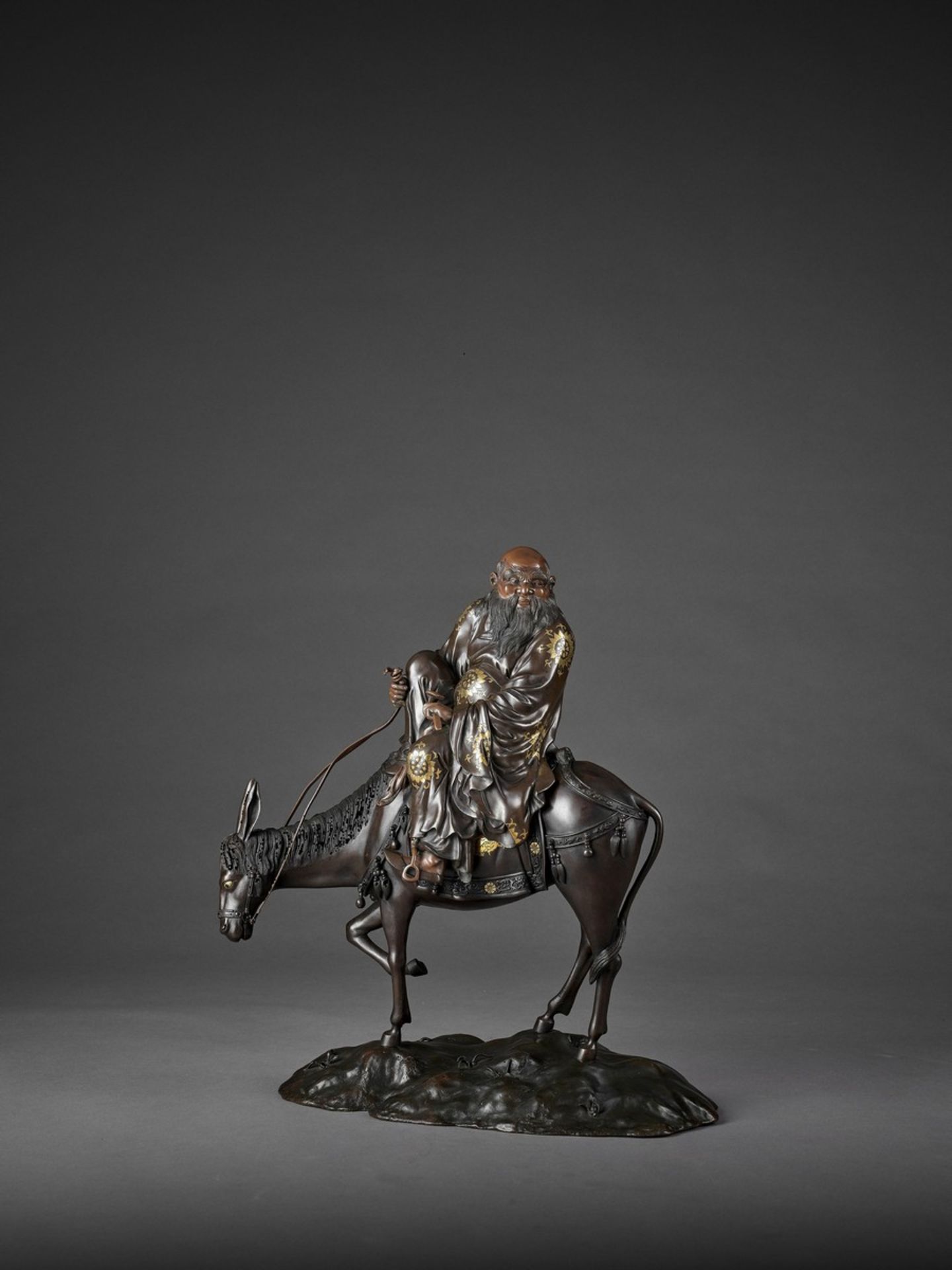 A SPECTACULAR AND MASSIVE PARCEL GILT BRONZE FIGURE OF TOBA SEATED ON A MULE Attributed to the Miyao - Image 4 of 12