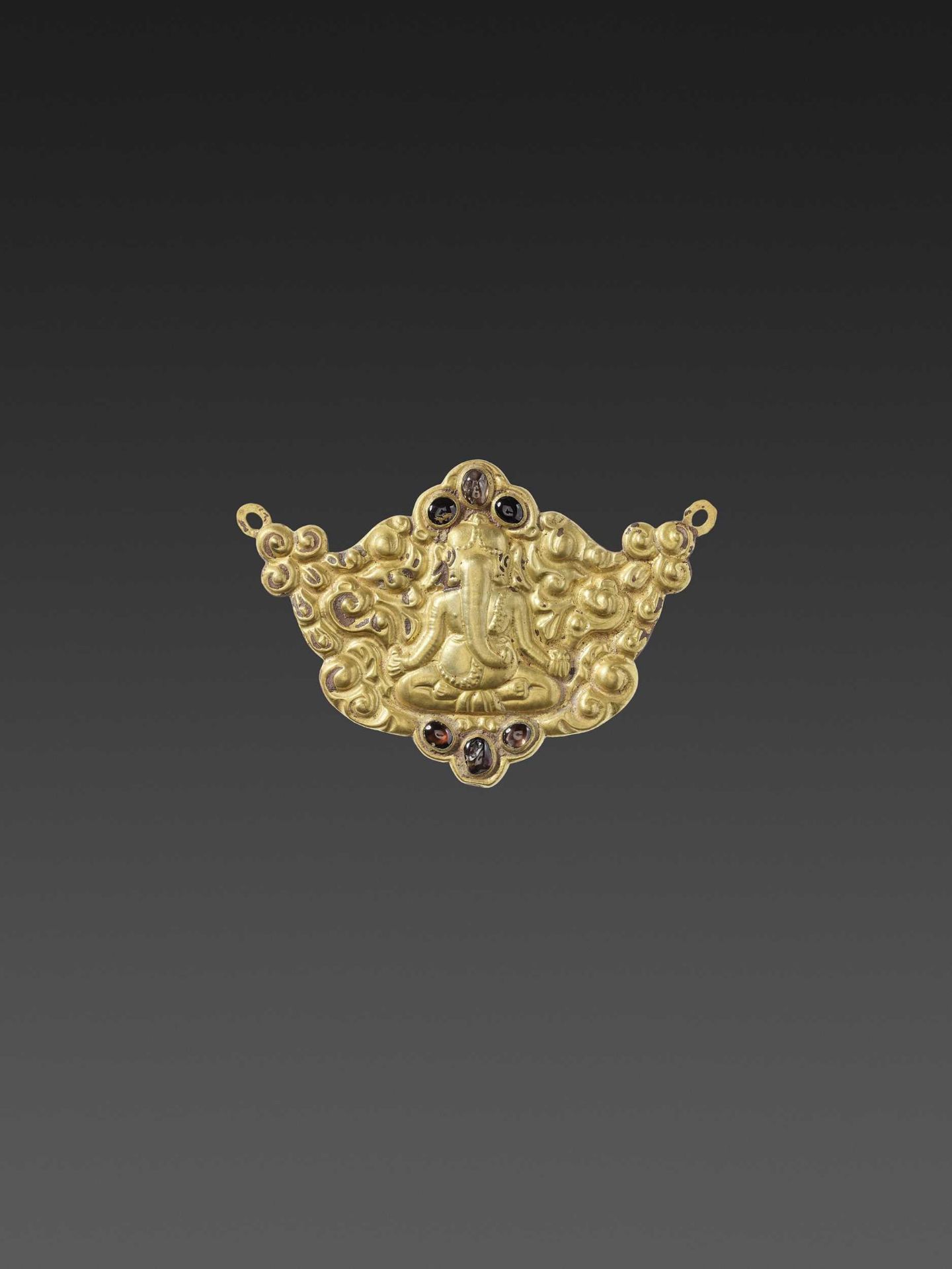 A CHAM GEMSTONE-SET GOLD REPOUSSÉ PECTORAL DEPICTING GANESHA MEDITATING