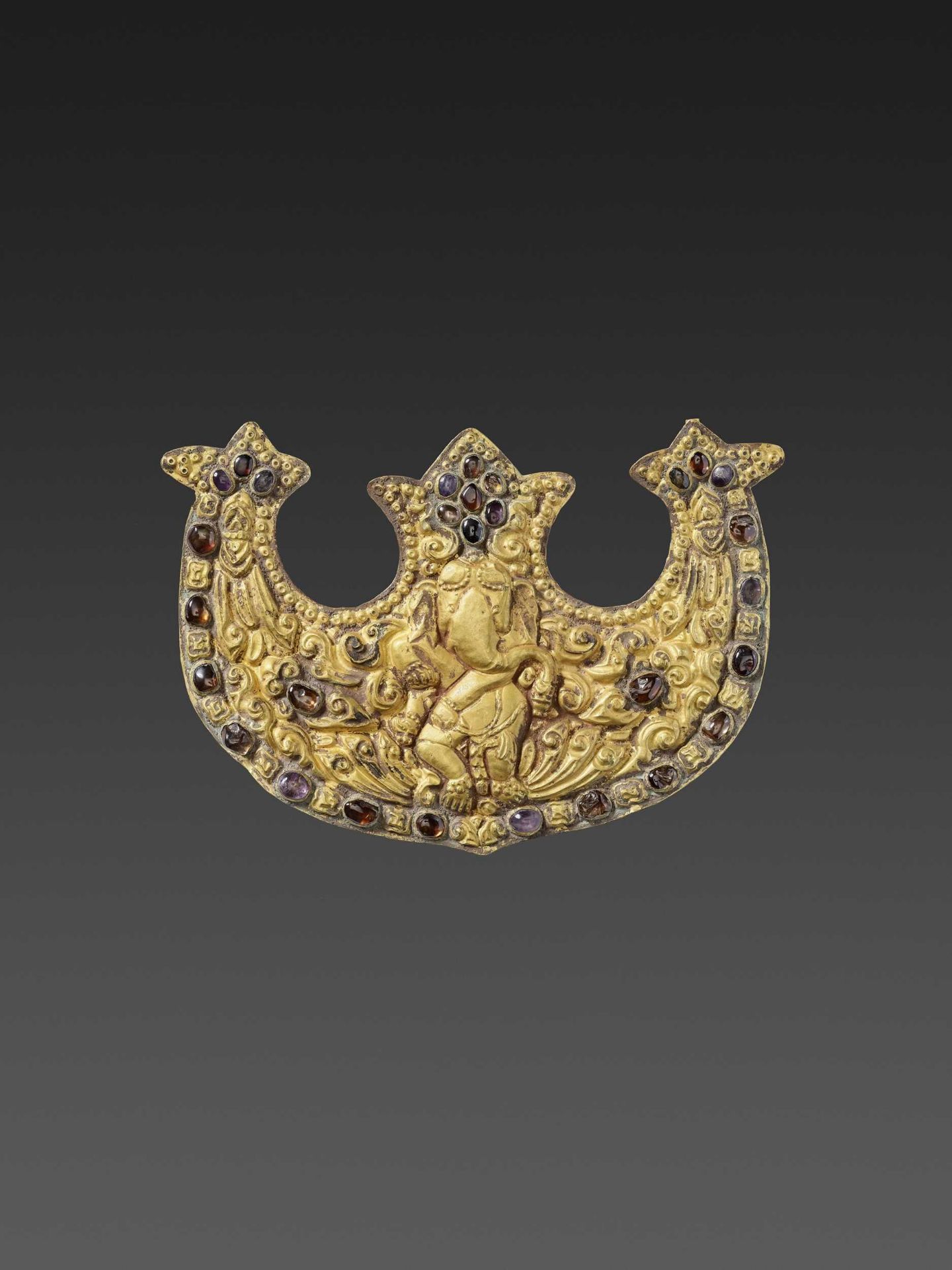 A CHAM GEMSTONE-SET GOLD REPOUSSÉ PECTORAL DEPICTING GANESHA DANCING