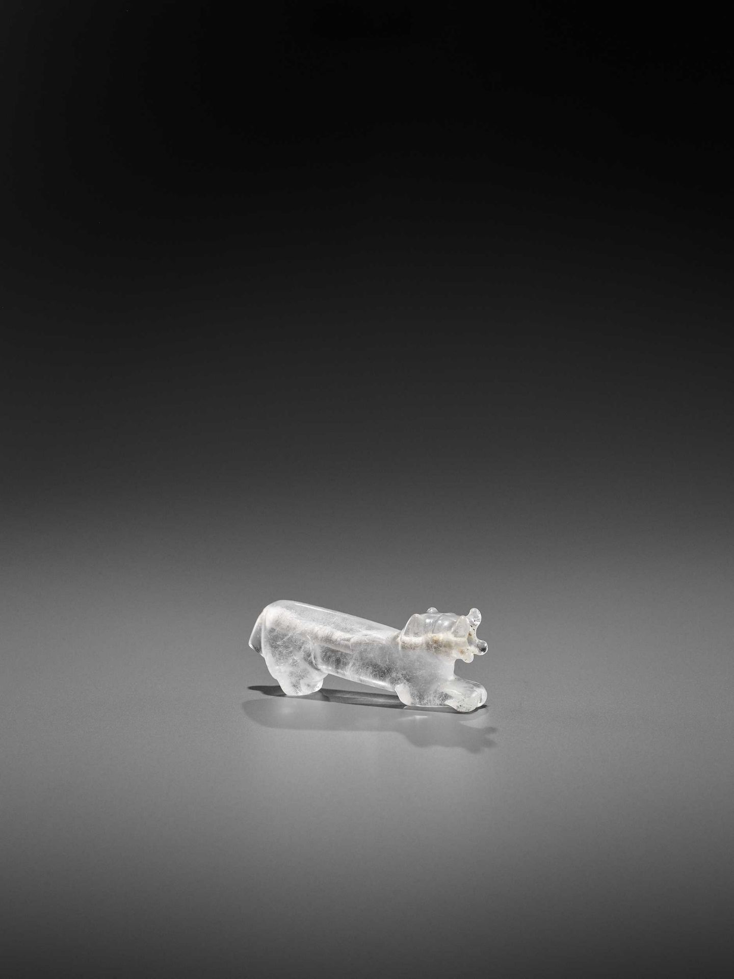 A VERY RARE PYU ROCK CRYSTAL TALISMAN DEPICTING A TIGER WITH CUB IN ITS MOUTH