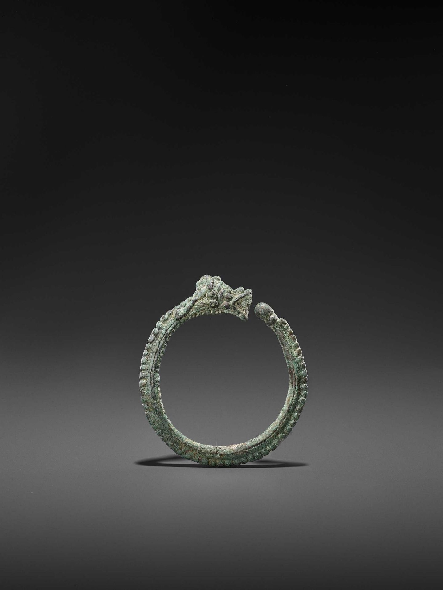 A BURMESE BRONZE ‘DRAGON’ BANGLE