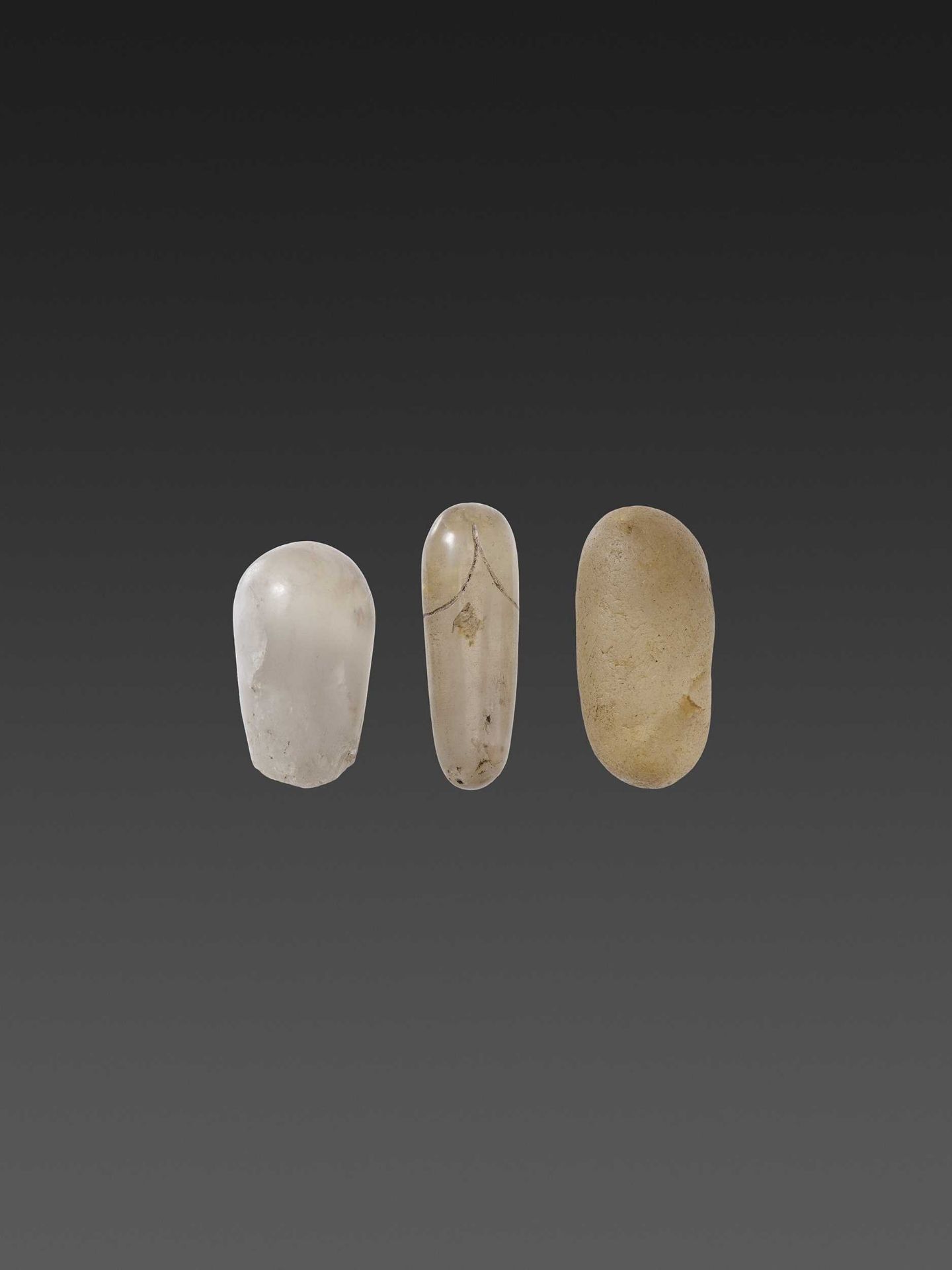 THREE KHMER EMPIRE ROCK CRYSTAL LINGAMS