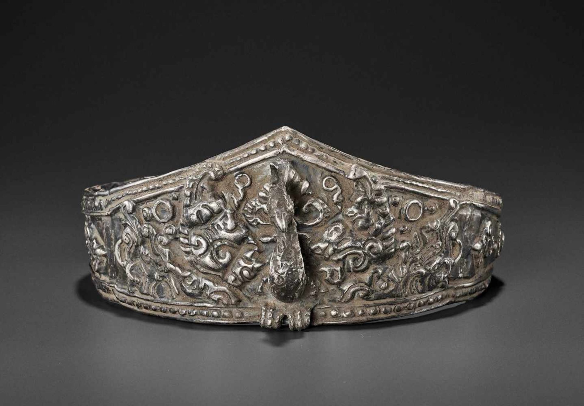 A LARGE ANDUNIQUE CHAM SILVERR EPOUSSÉ CROWN WITH A PHOENIX