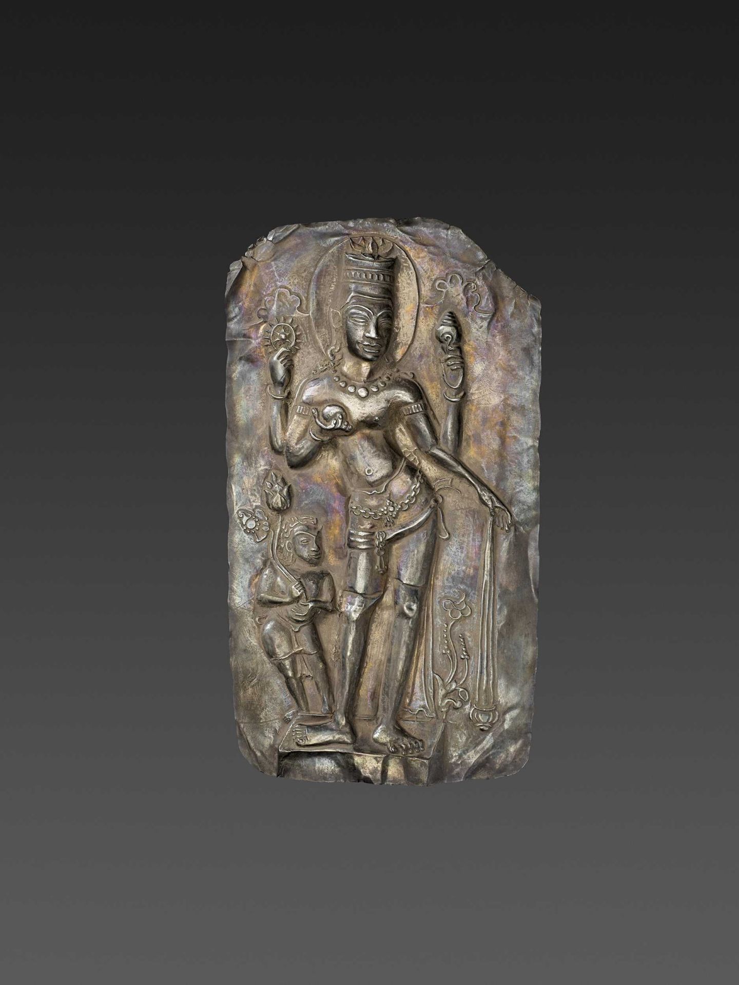 A LARGE CHAM SILVER REPOUSSÉ PLAQUE DEPICTING VISHNU AND CHILD