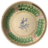Majolica plate of Caltagirone, XX Century. Decorated with flower. 33 cm.