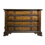 Drawers of tooled, walnut wood on the front and side with human figures and animals. Eighteenth