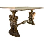 Coffee table, twentieth century. Marble top supported by putti. H cm 56x110x60.